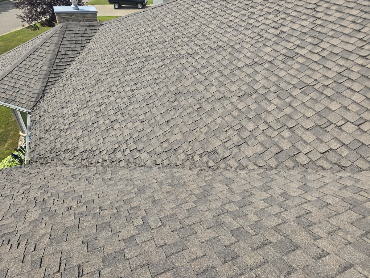 Weathered asphalt shingles on a roof