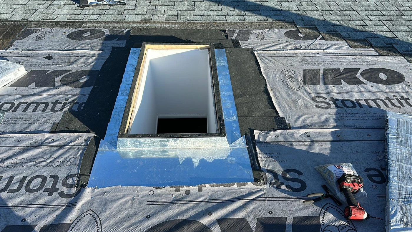 Roof opening and surrounding underlayment during skylight installation