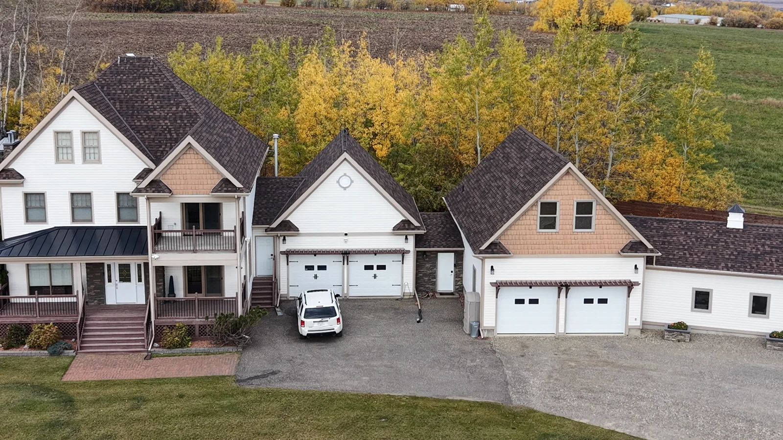 Steep multi-gabled custom shingle roof in Dean drone footage