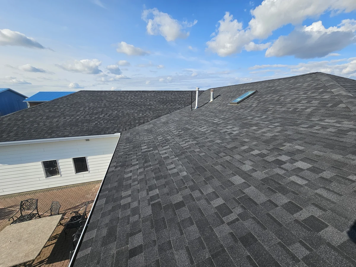 Asphalt shingle roof slopes with a skylight and roof penetrations