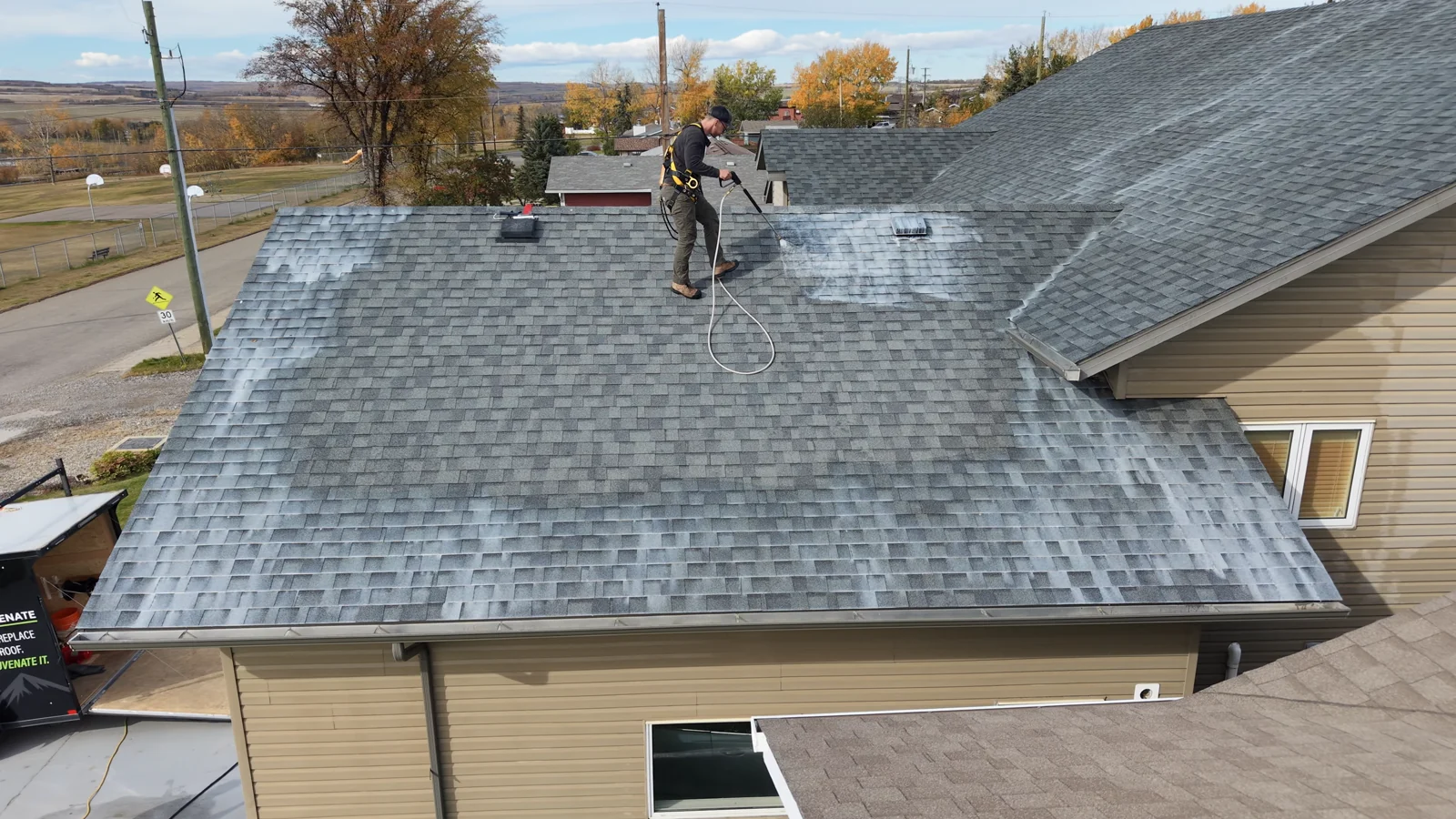 Roof rejuvenation application on a garage roof from client drone footage