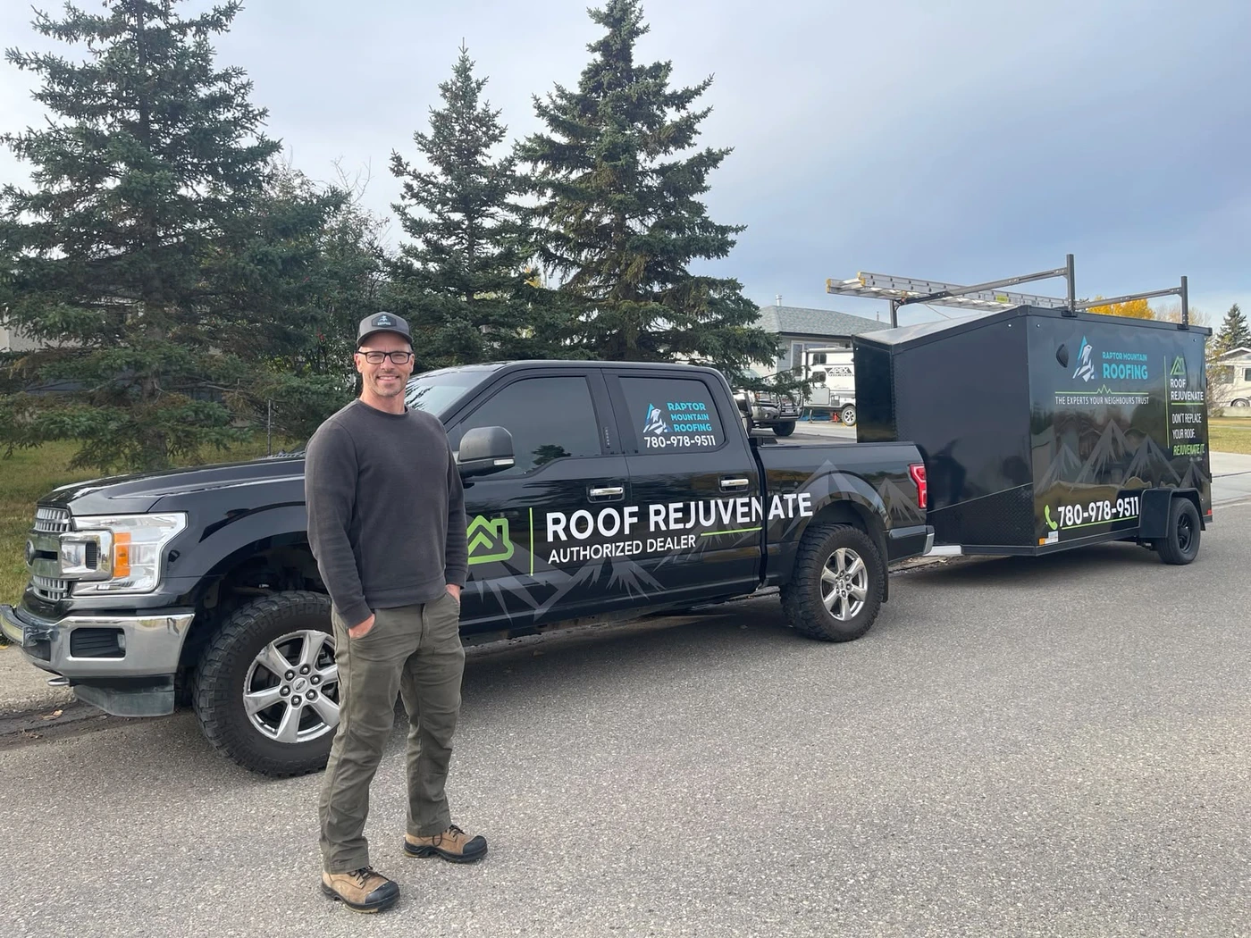 Sheldon beside the Roof Rejuvenate truck and trailer